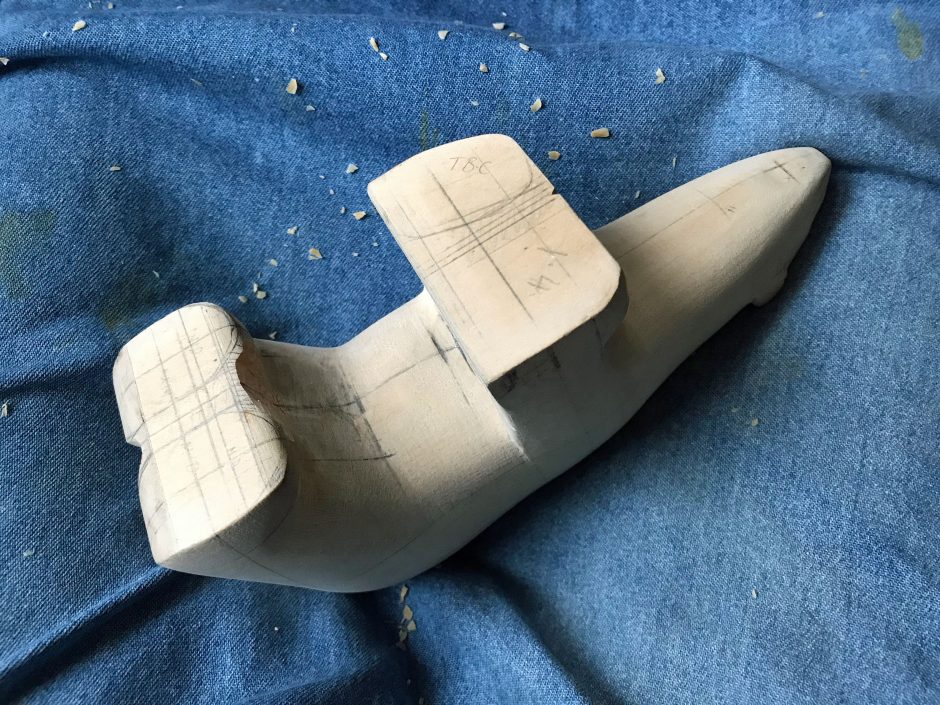 Wooden model of Polar bear lying upside down, shows scale as 1:4