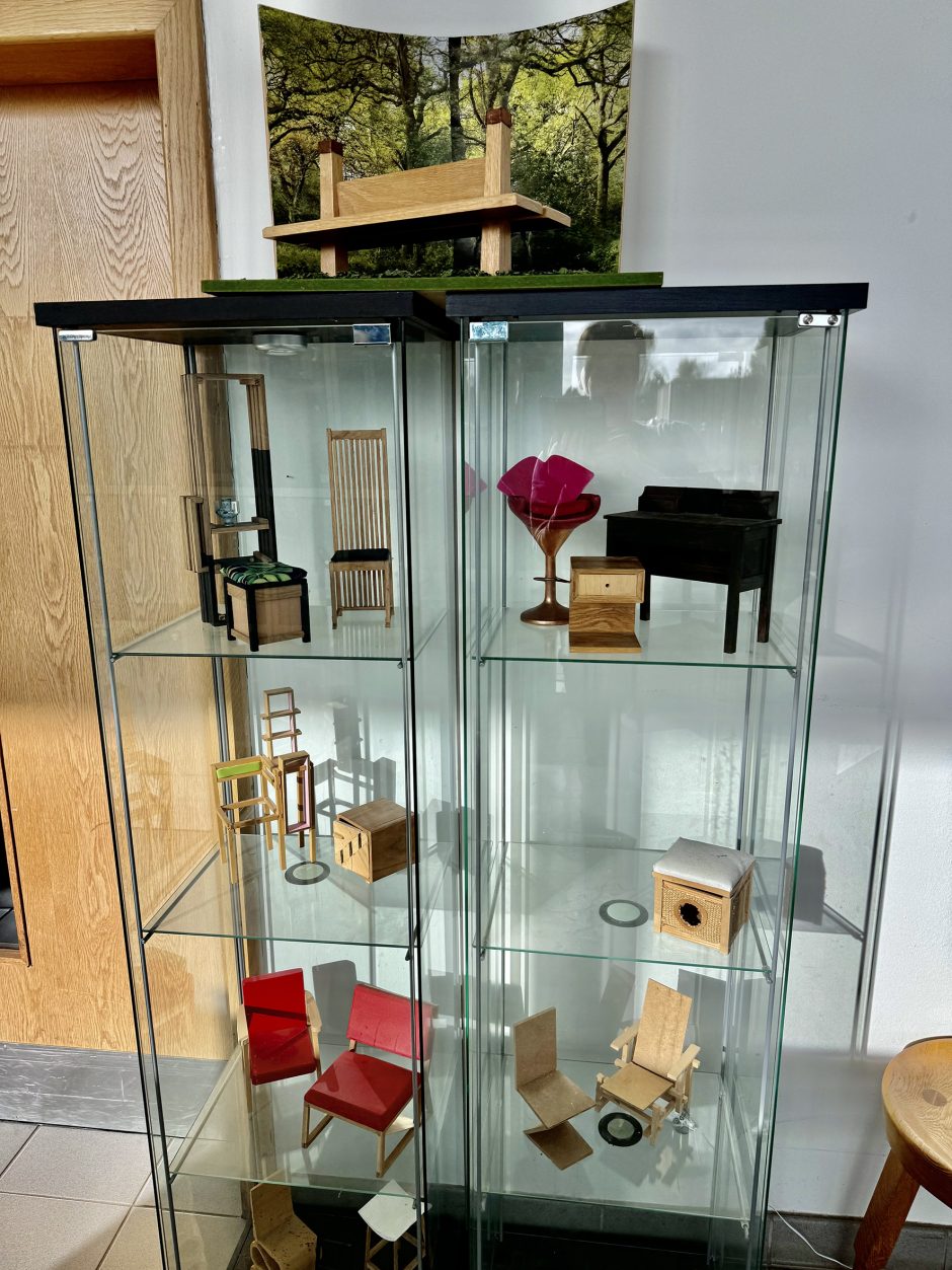 Display case with models for furniture in it.