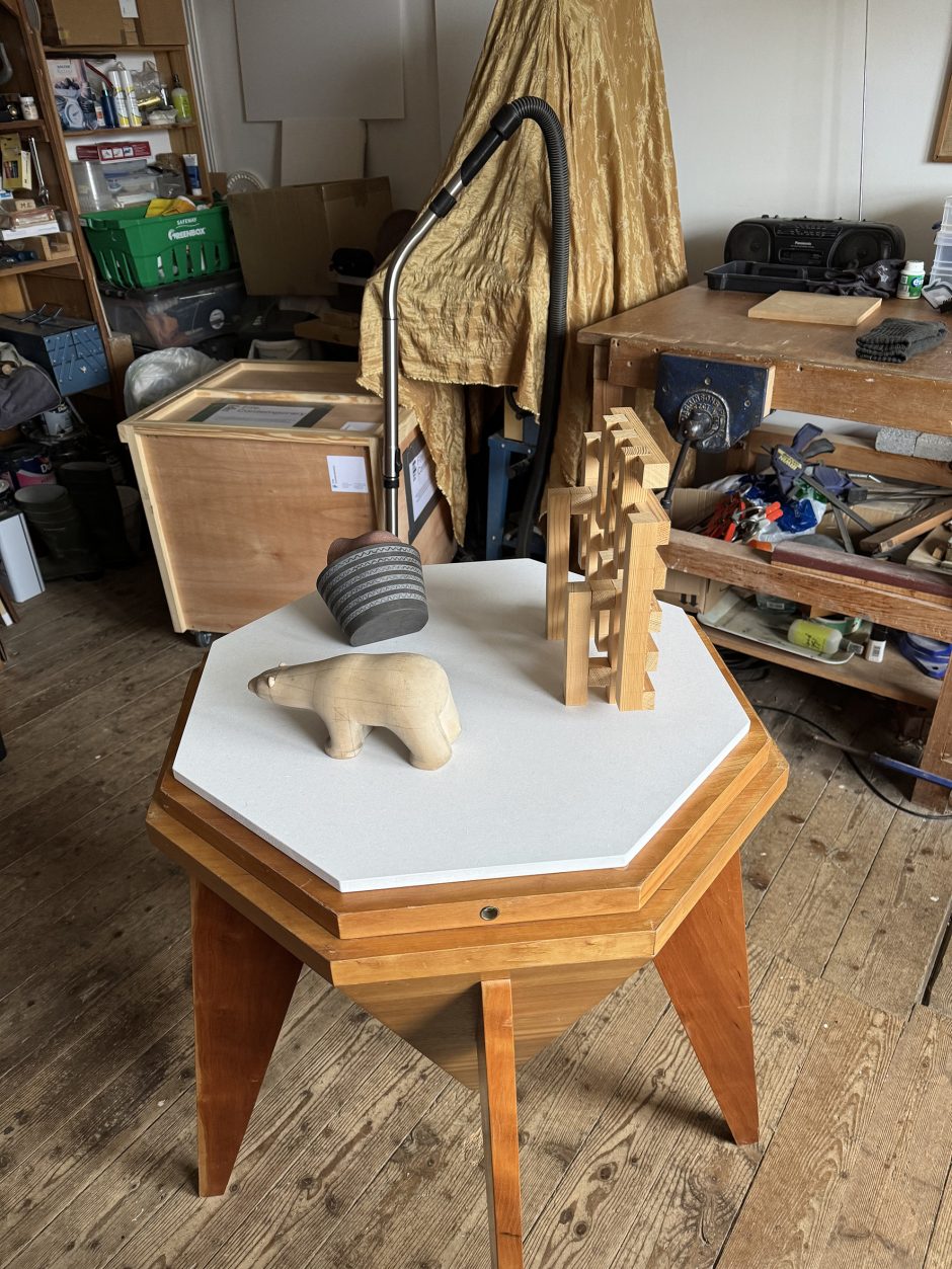 Three models for sculptures on an octagonal base.