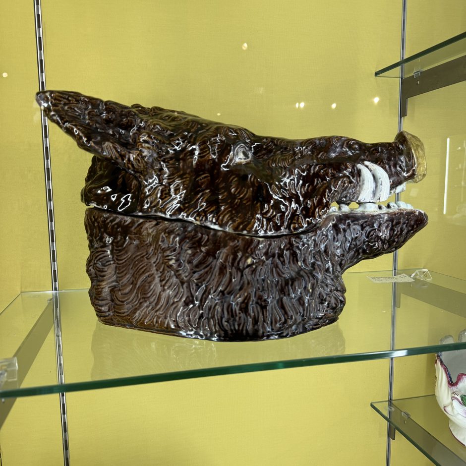 A brown ceramic boar's head