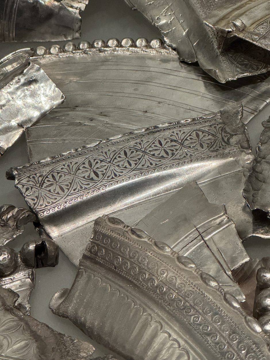 Selection of decorated hack silver, in the centre a repeat pattern of stylised flowers